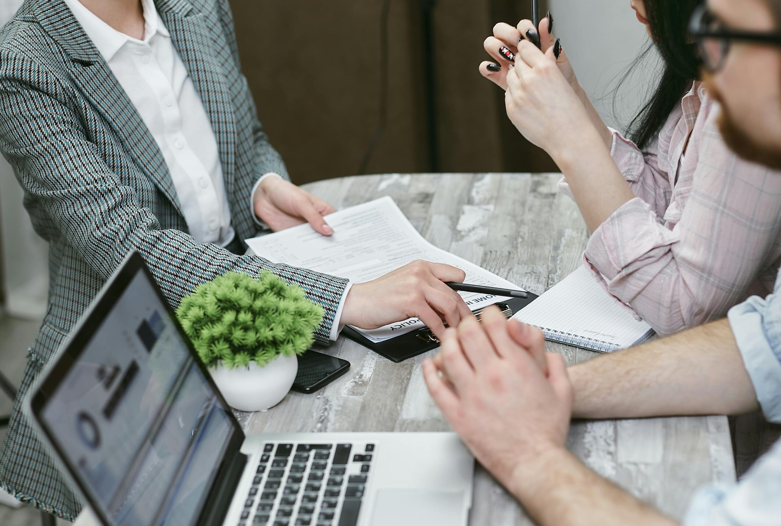 Leasing agent reviewing documents with renters